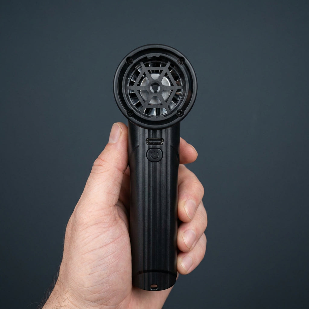 Studio photo of the AirBlaster Pro held in hand, showing the powerful back turbine air intake and grill design.